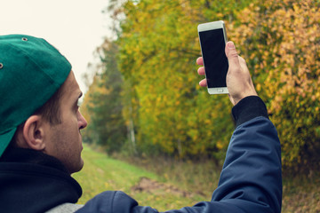 Man lost in the woods, tourist is looking for network GPS