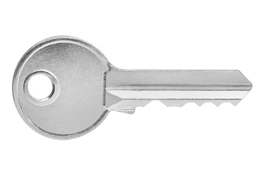 Close-up of a single key, isolated on white background