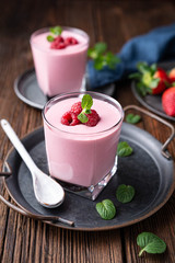 Healthy drink, strawberry and raspberry smoothie with Greek yogurt in a glass jar