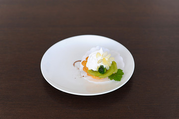 Cream dessert on white plate