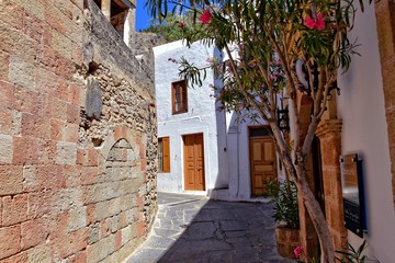 Fototapeta na wymiar landscape from the historic city of lindos on the greek island of rhodes with white old tenement houses