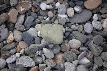 Fototapeta na wymiar Texture pebbles. Large stones. Beautiful background. Coast. Beautiful gray beach.