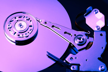 An open computer hard drive for repair. HDD. Components for ps. Storage and restoration of digital data.