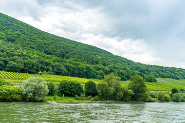 Germany, Rhine Romantic Cruise, a large body of water with a mountain in the middle of a field