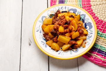 Mexican chorizo with potatoes on white background