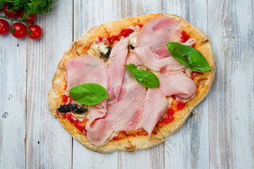 Pinsa with parma ham and mushrooms, rome pizza.