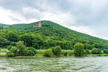 Fototapeta na wymiar Germany, Rhine Romantic Cruise, a body of water with a mountain in the background