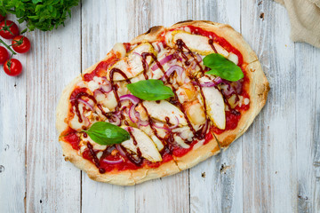 Roman pizza with chicken and bbq sause on Roman dough, pinsa