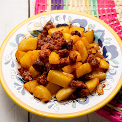 Mexican chorizo with potatoes on white background