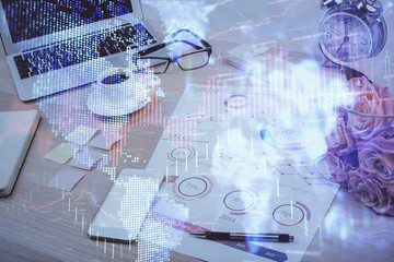 Financial chart drawing and table with computer on background. Double exposure. Concept of international markets.