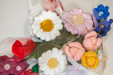 Fototapeta na wymiar crocheted flowers and toys