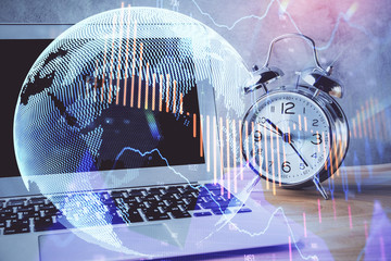 Double exposure of chart and financial info and work space with computer background. Concept of...