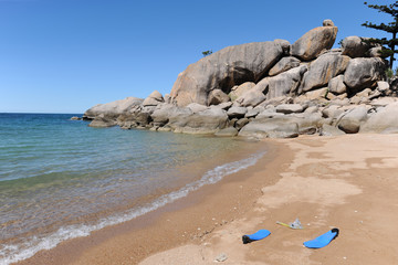 Swim fins on the beach at Arthur Bay, Magnetic Island, Queensland Australia.