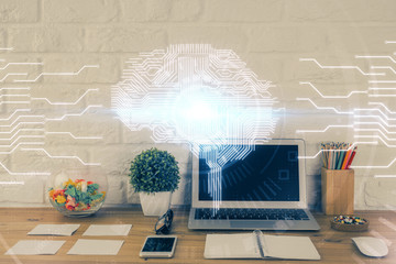 Double exposure of work space with computer and human brain drawing hologram. Brainstorm concept.