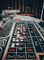 Casino concept background. Poker chips on the table. A gaming table in a luxury casino. Casino...