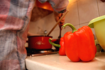Red pepper on a kitchen counter. Selective focus.