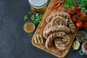 grilled sausages with a glass of beer