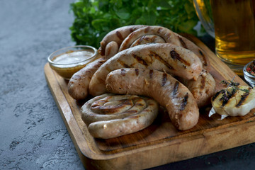 grilled sausages with a glass of beer