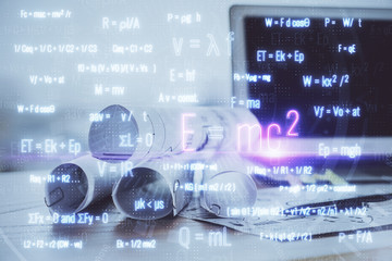 Desktop computer background and formula hologram writing. Double exposure. Education concept.