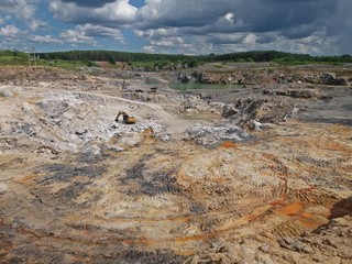 Backhoe is digging for gypsum ore at the mine