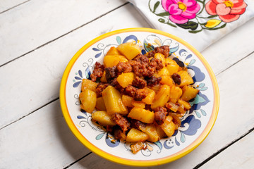Mexican chorizo with potatoes on white background