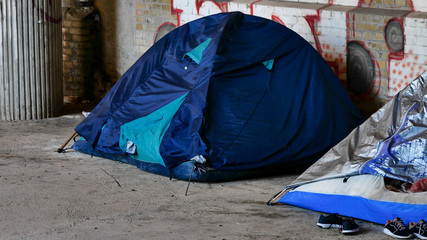 Homeless migrants in europe. Tent camp homeless under the bridge in berlin. The concept of social problems in Europe, the problem of migration, the problem of employment.