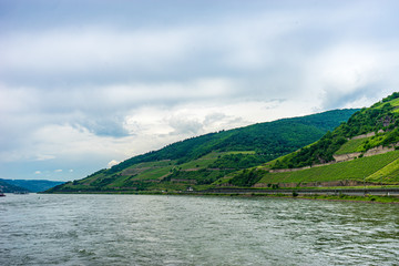 Germany, Rhine Romantic Cruise, a large body of water with a mountain in the background