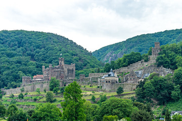 Fototapeta na wymiar Germany, Rhine Romantic Cruise, a castle on top of a lush green hillside