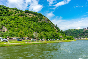 Germany, Rhine Romantic Cruise, a large body of water with a mountain in the background