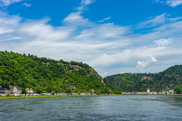 Fototapeta premium Germany, Rhine Romantic Cruise, a small boat in a large body of water