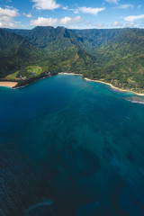 Aerial View of Beautiful Kauai Coast in Hawaii with Blue Water and Coral Reef and Mountains