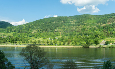 Fototapeta premium Germany, Hiking Frankfurt Outskirts, a body of water with a mountain in the background