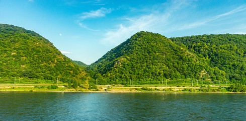 Fototapeta premium Germany, Hiking Frankfurt Outskirts, a body of water with a mountain in the background
