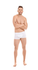 Handsome man in underwear on white background