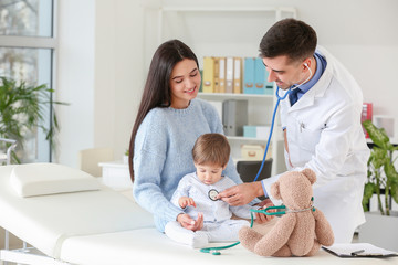 Woman with little baby visiting pediatrician in clinic