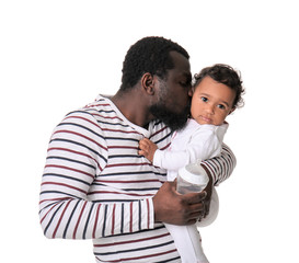 African-American man with his cute baby on white background