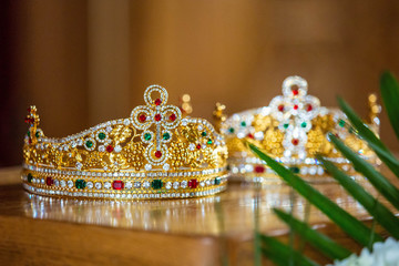 Pair of traditional orthodox christian crowns for marriage ceremony