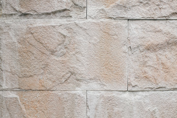 Abstract grungy rusty blocks of stone. wallpaper texture background with old dirty and vintage style pattern.Ancient stonewall fort or stronghold - surface of brown rock bricks