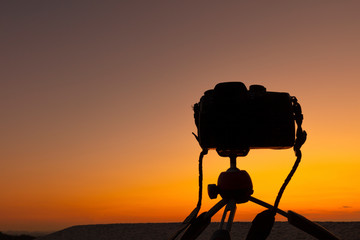 Silhouette of Camera on Tripod at Sunset