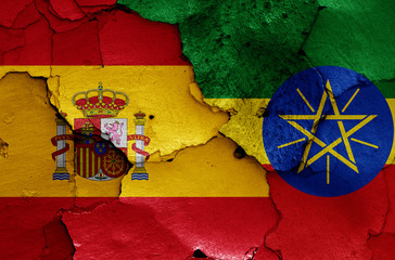 flags of Spain and Ethiopia painted on cracked wall