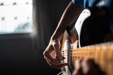 Playing guitar at home