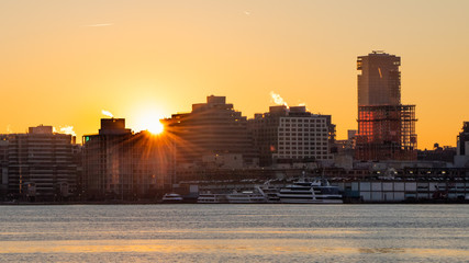 Sunrise offers a partial silhouette of the west side skyline