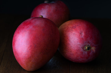 Red Mangoes on wood boards