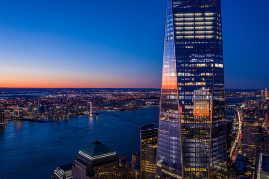 Aerial View Of New York City And One World Trade Center Brookfield Place At Dusk.