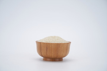 Rich and full rice in wooden bowl, retro style