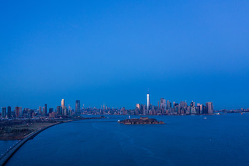 Fototapeta premium Aerial view of Manhattan waterfront and Governors Island, New York