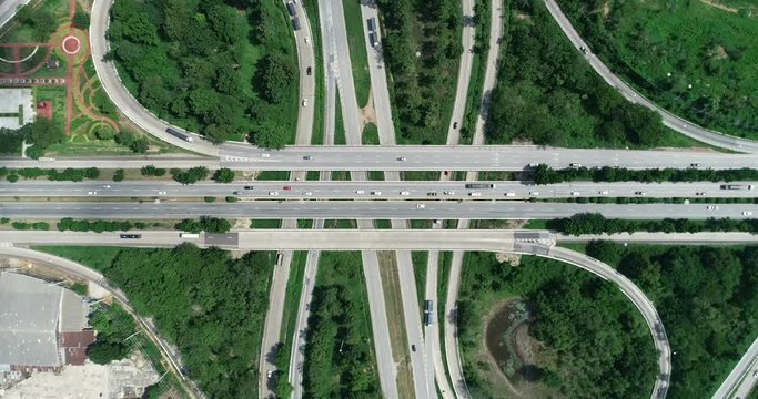 traffic on 4-way stop street intersection circle roundabout in bangkok, thailand. 4K UHD horizontal aerial view.