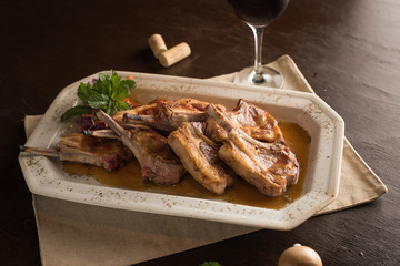 Sheep entrecote meat with Madeira sauce, accompanied with red wine