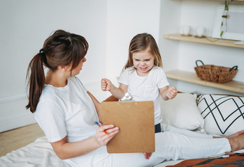 Mother and daughter playing, girl is angry, she lives negative emotions. Children psychological...