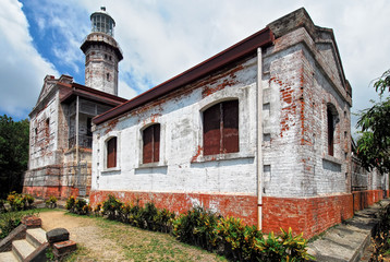 Fototapeta na wymiar Low angle view of the old colonial Cape Bojeador Lighthouse tourist attraction, near Burgos, Ilocos Norte, North Luzon, Philippines, Asia